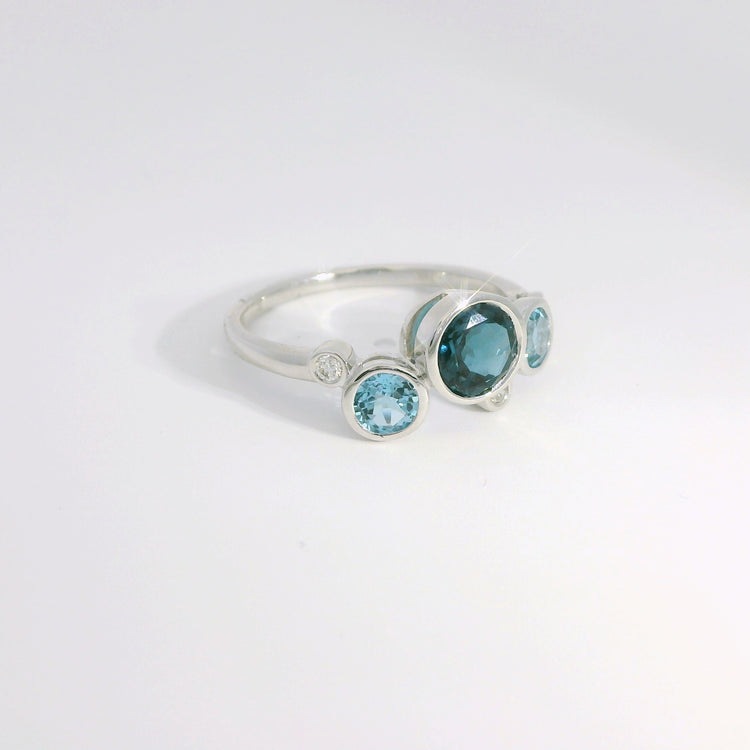 Round Bezel Set Blue Topaz and Diamond Ring