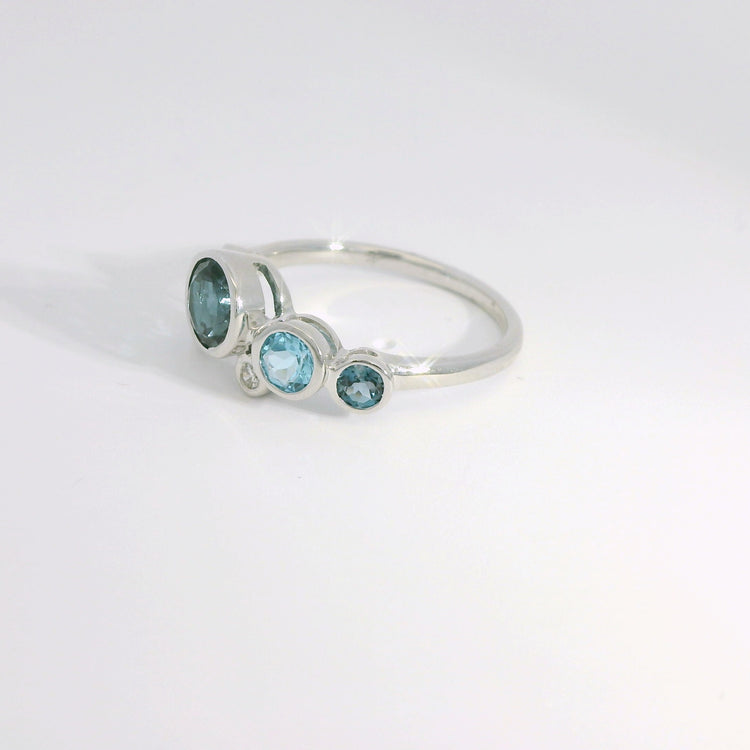 Round Bezel Set Blue Topaz and Diamond Ring