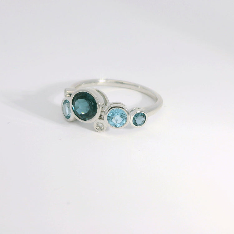 Round Bezel Set Blue Topaz and Diamond Ring