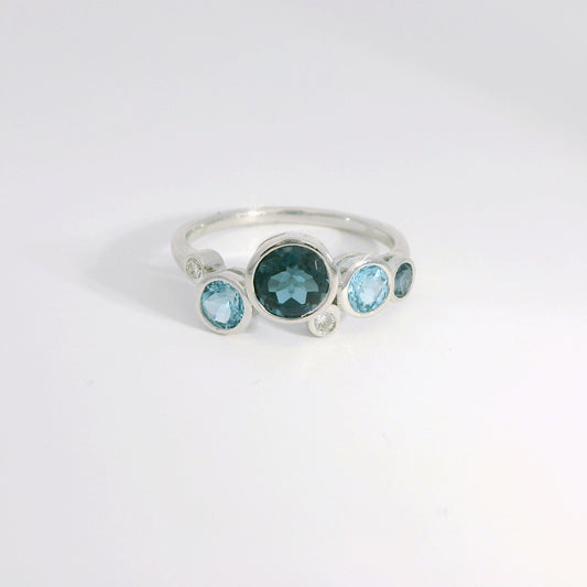 Round Bezel Set Blue Topaz and Diamond Ring