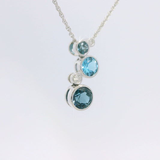 Round Bezel Set Blue Topaz and Diamond Pendant