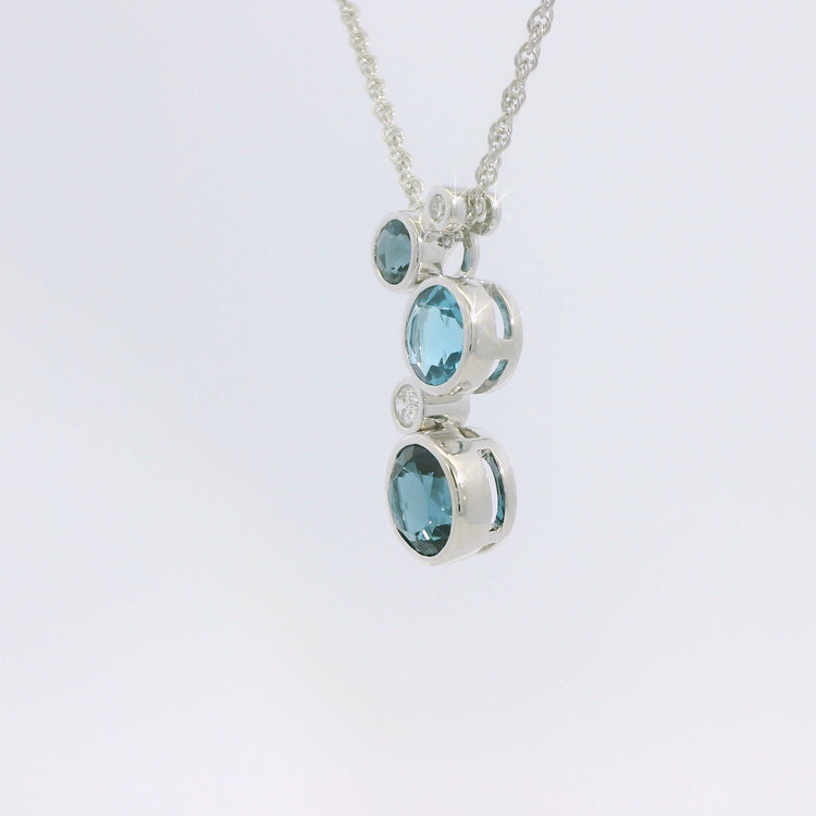 Round Bezel Set Blue Topaz and Diamond Pendant