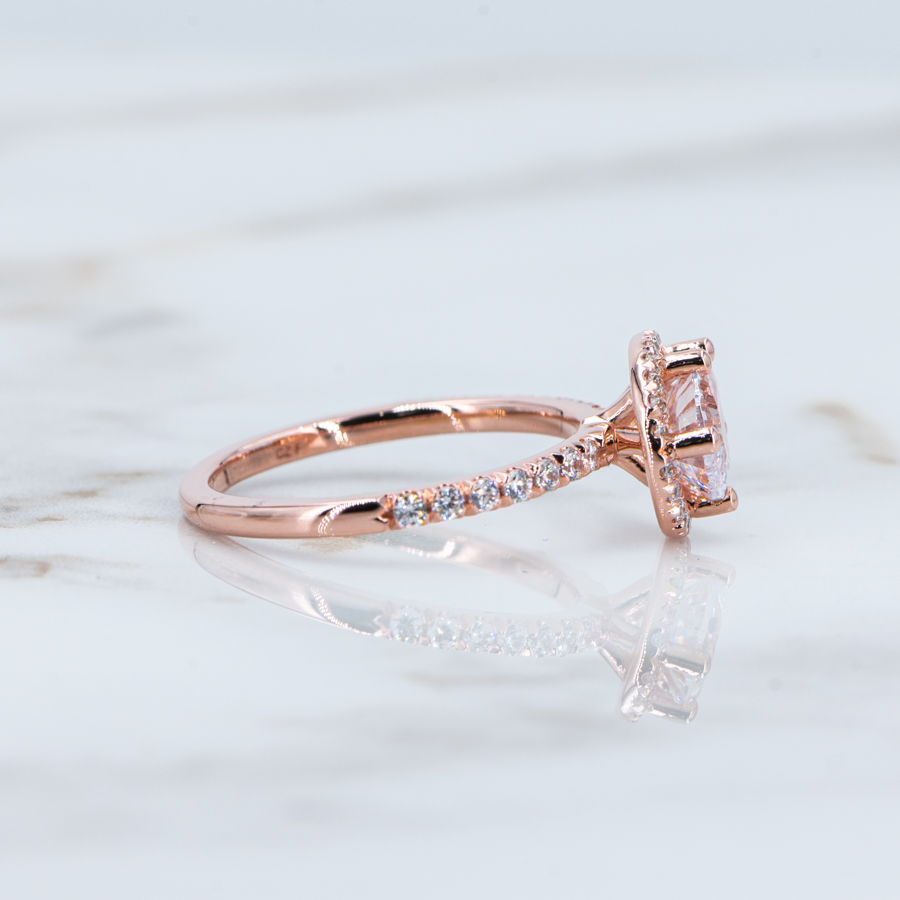 Asymmetric ring with a diamond in pink gold