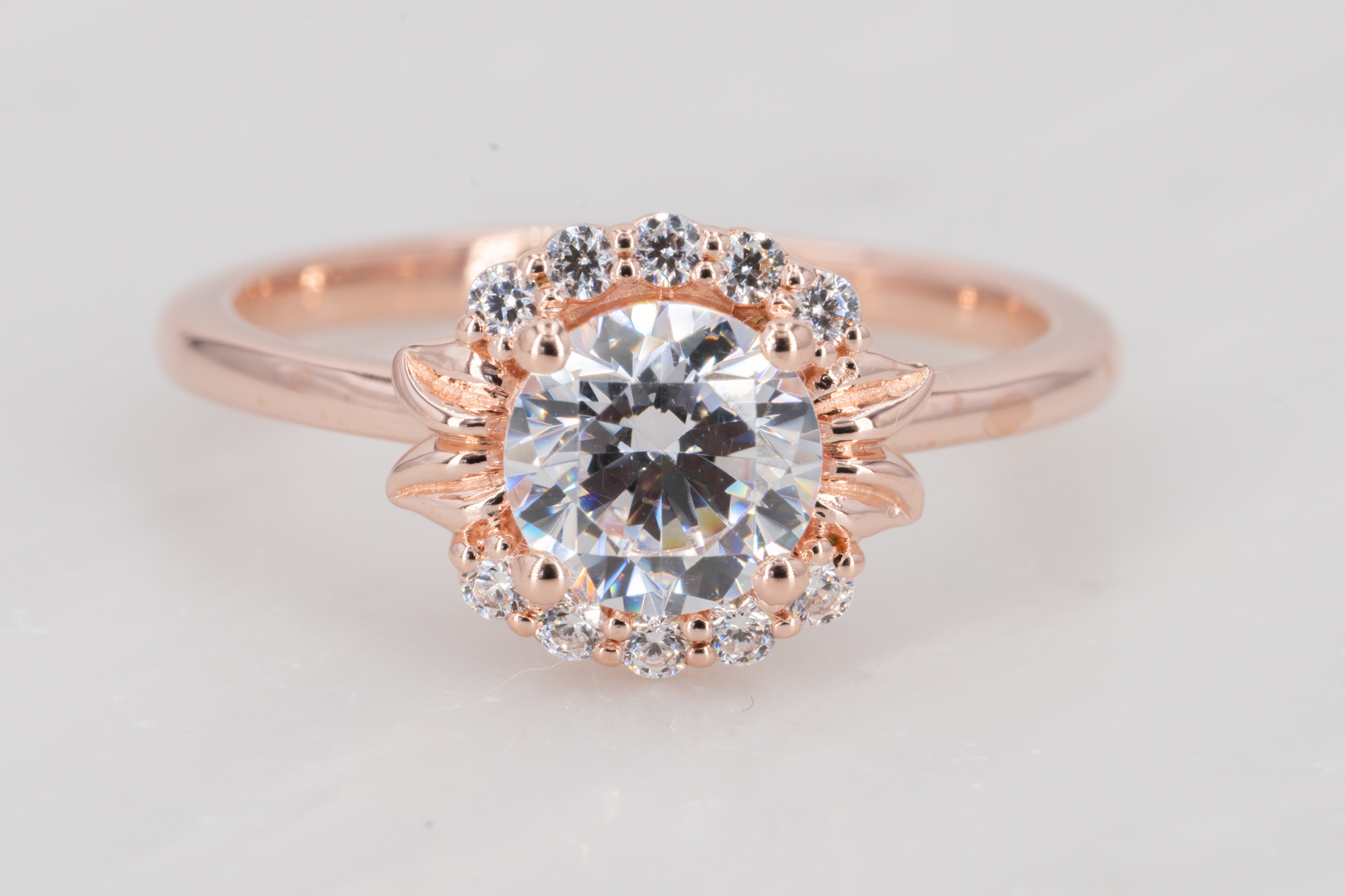 Rose gold engagement ring simple round